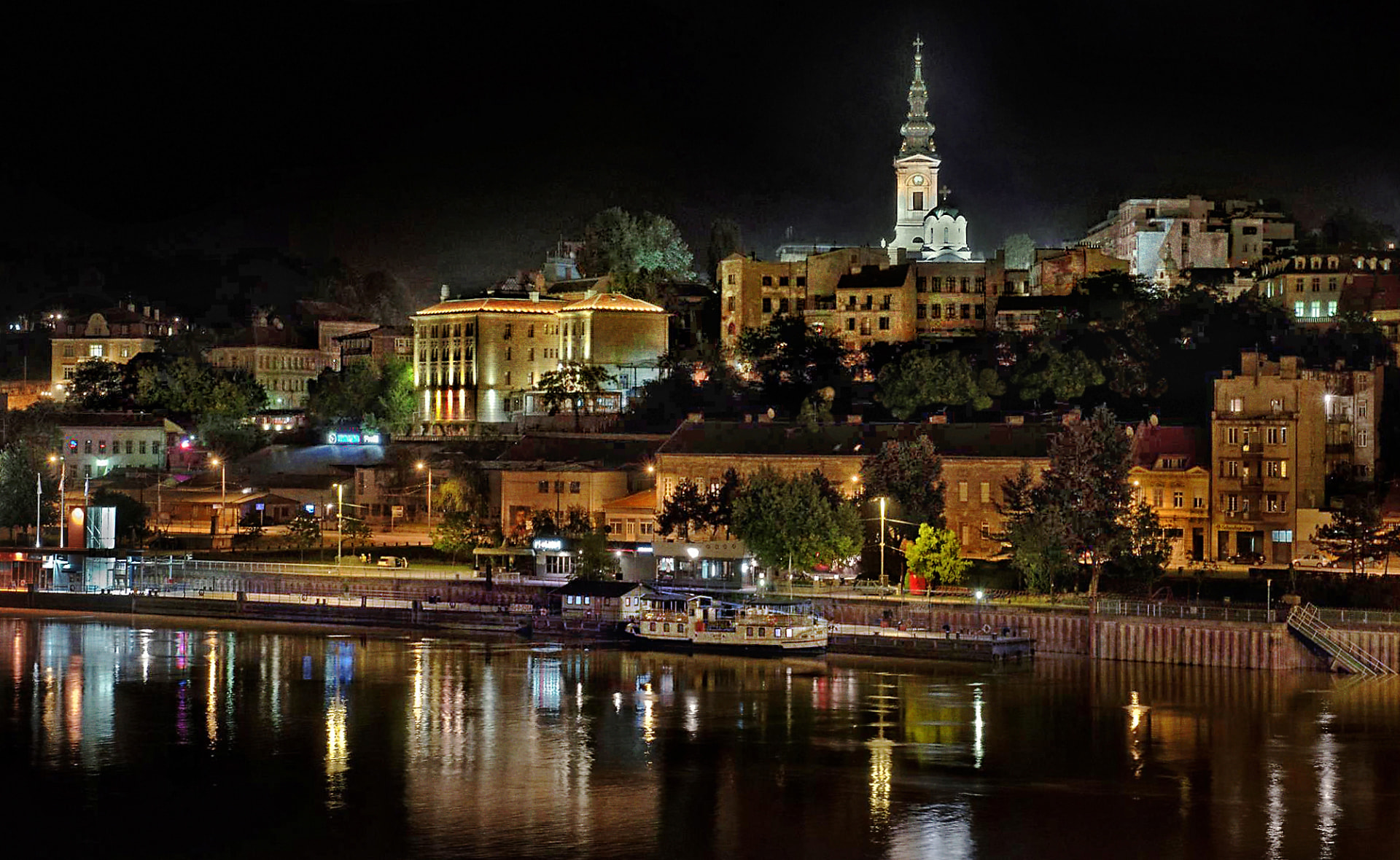 Belgrade waterfront and old city illuminated at night